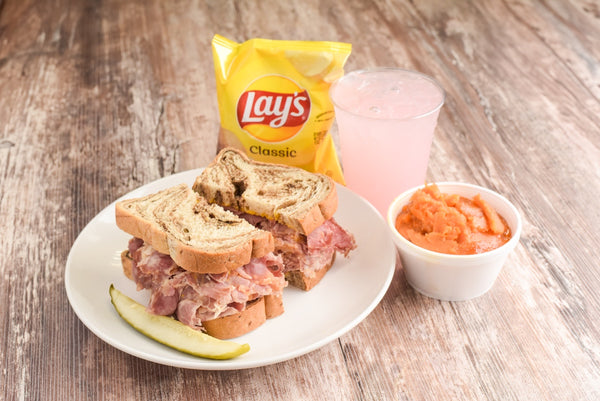 Sandwich, chips, slaw, and something sweet to sip.